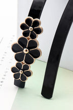 Cinturón fino de PU con decoración floral